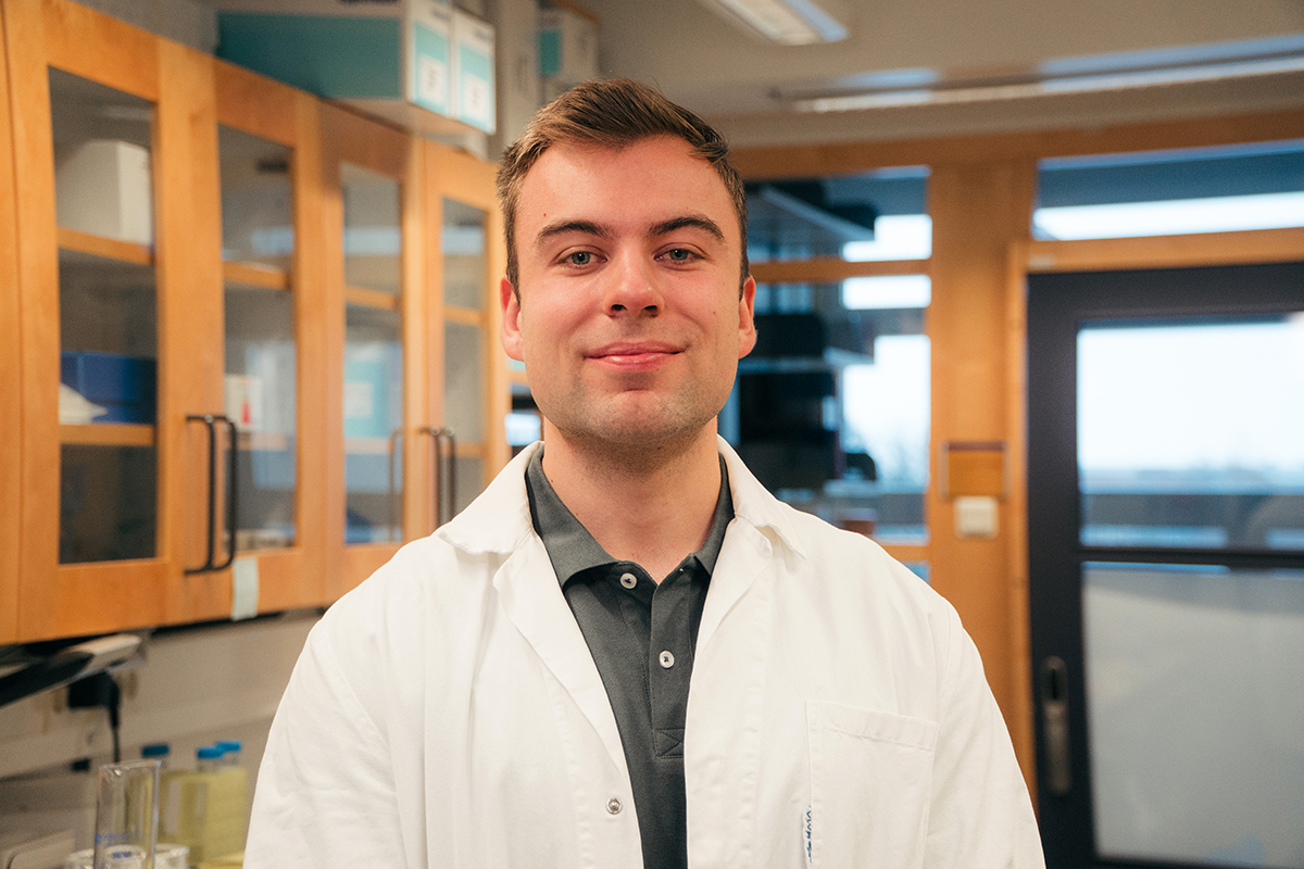 Erik Hartman wearing a laboratory coat.